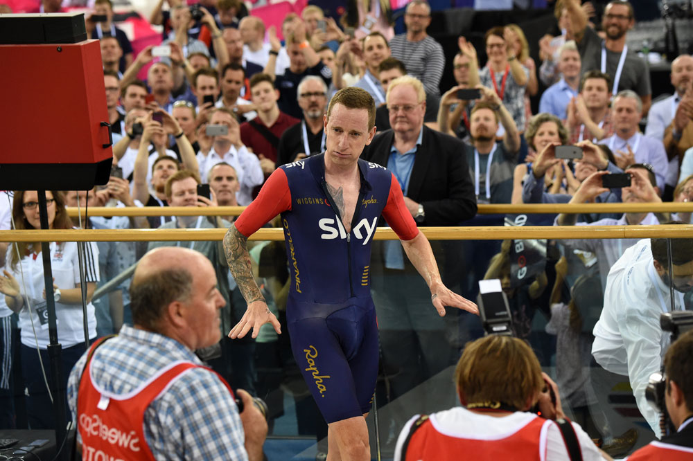 After a couple of warm-down laps, Wiggins climbed off the bike