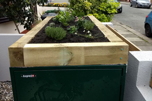 Asgard metal bike safe with green roof planter