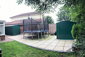 Two Gladiator Sheds in Garden