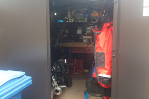 Motorcycle storage with a workbench to create a tool shed and work shop