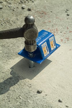 Fitting a ground anchor knocking in Fitting a ground anchor knocking in