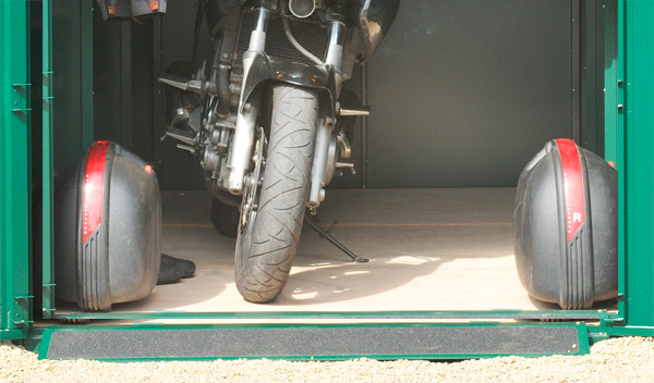 Large motorcycle garage with metal floor