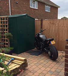 A bricked patio gives easy access into the Asgard Centurion Motorbike Storage