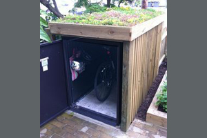 Customer bike safe with bespoke cladding and garden roof