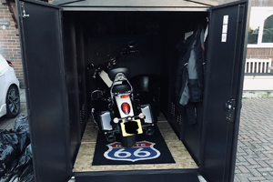 Secure motorcycle storage with motorbike matt